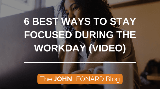 Alt text: A professional works attentively at a laptop in an office setting beside a coffee mug, with overlay text reading “6 Best Ways to Stay Focused During the Workday (Video)” and branding for The JOHNLEONARD Blog. The graphic promotes workplace productivity, focus strategies, time management, and employee wellness tips for professionals seeking to improve concentration and efficiency during the workday.